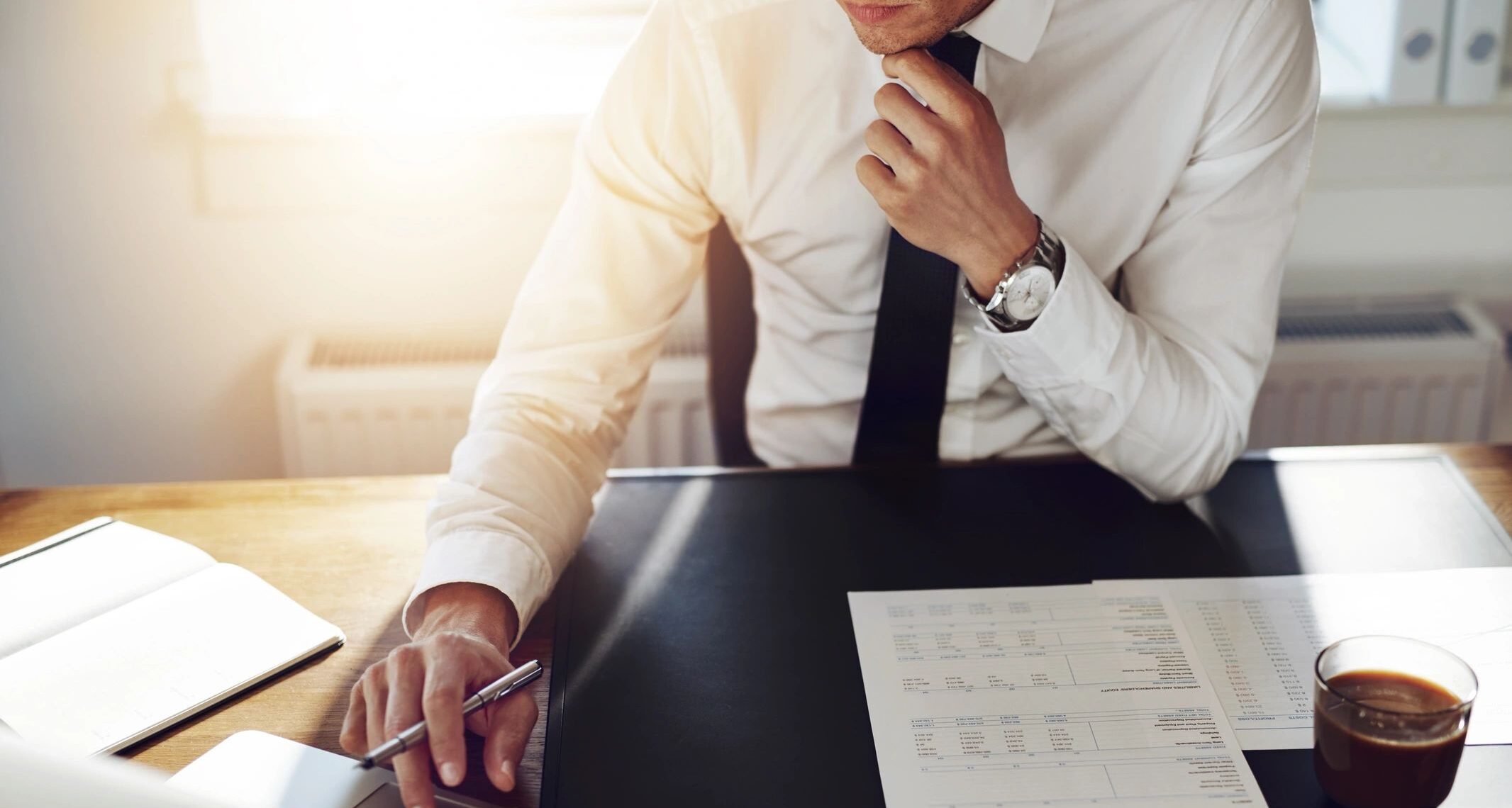 Small business owner researching Covid-19 relief plans at his desk